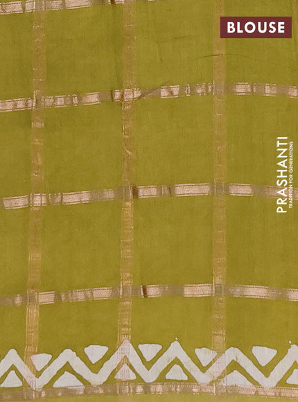 Semi chanderi saree lime green with allover zari checks & batik prints in borderless style