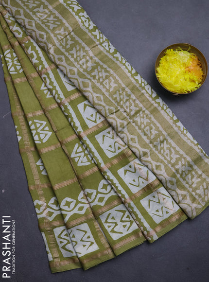 Semi chanderi saree mehendi green with allover zari checks & batik prints in borderless style