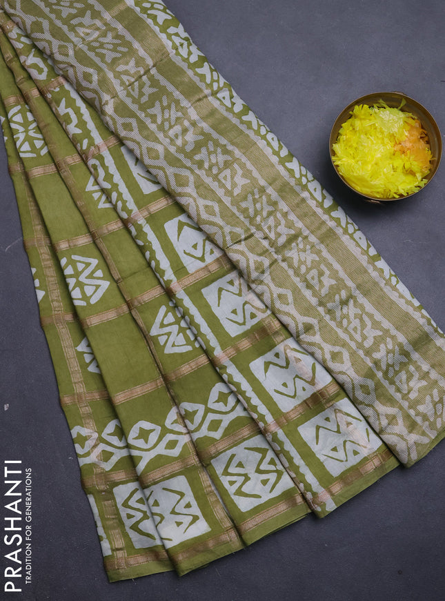 Semi chanderi saree mehendi green with allover zari checks & batik prints in borderless style