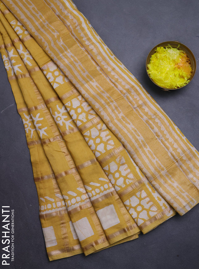 Semi chanderi saree mustard with allover zari checks & batik prints in borderless style