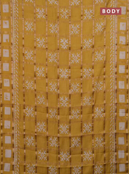 Semi chanderi saree mustard with allover zari checks & batik prints in borderless style