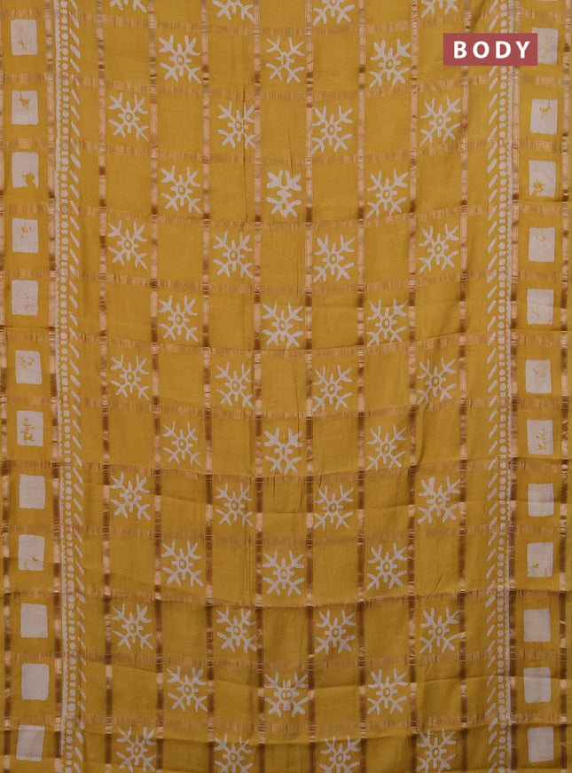 Semi chanderi saree mustard with allover zari checks & batik prints in borderless style