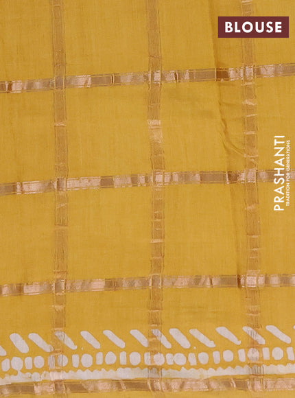 Semi chanderi saree mustard with allover zari checks & batik prints in borderless style