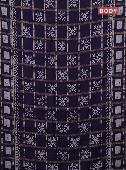 Semi chanderi saree navy blue with allover zari checks & batik prints in borderless style