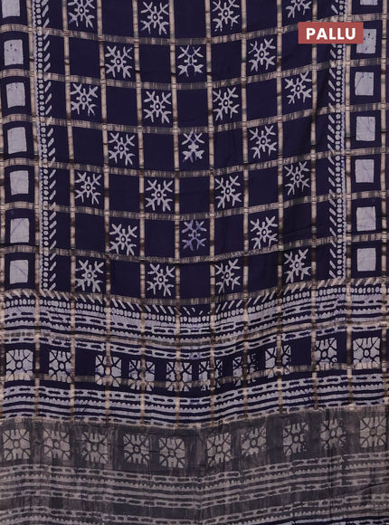 Semi chanderi saree navy blue with allover zari checks & batik prints in borderless style
