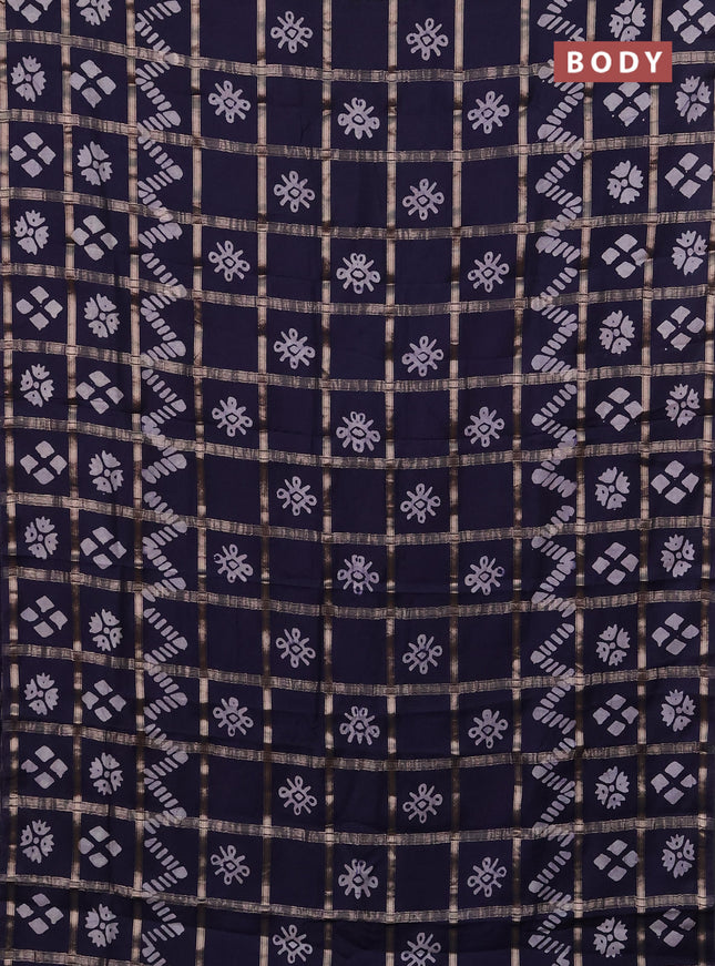 Semi chanderi saree navy blue with allover zari checks & batik prints in borderless style