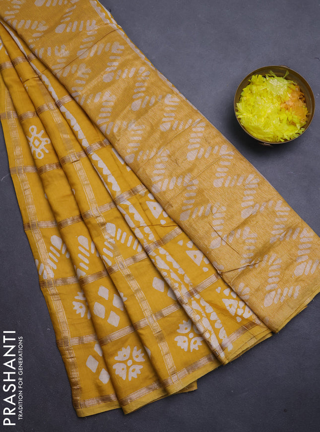 Semi chanderi saree mustard with allover zari checks & batik prints in borderless style