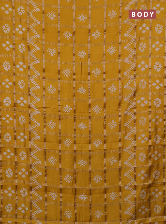 Semi chanderi saree mustard with allover zari checks & batik prints in borderless style