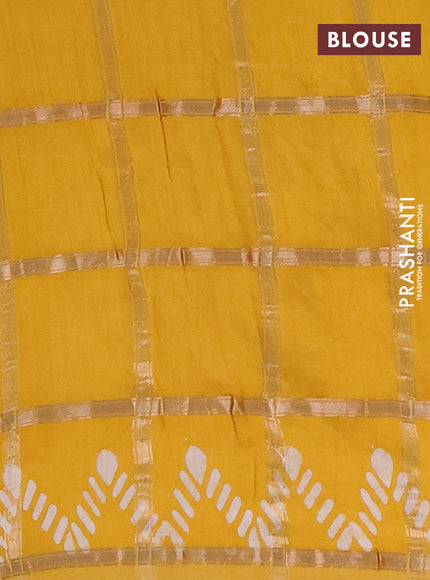 Semi chanderi saree mustard with allover zari checks & batik prints in borderless style