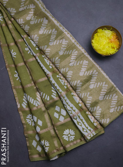 Semi chanderi saree mehendi green with allover zari checks & batik prints in borderless style