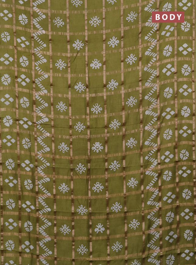 Semi chanderi saree mehendi green with allover zari checks & batik prints in borderless style
