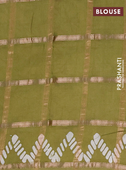 Semi chanderi saree mehendi green with allover zari checks & batik prints in borderless style