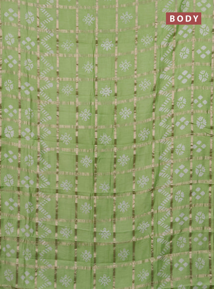 Semi chanderi saree pista green with allover zari checks & batik prints in borderless style