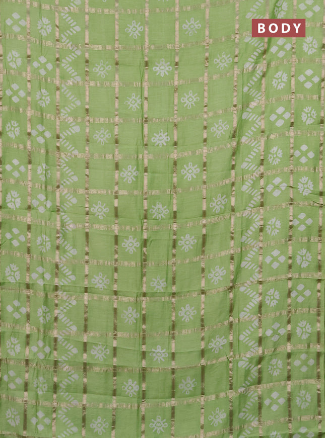 Semi chanderi saree pista green with allover zari checks & batik prints in borderless style