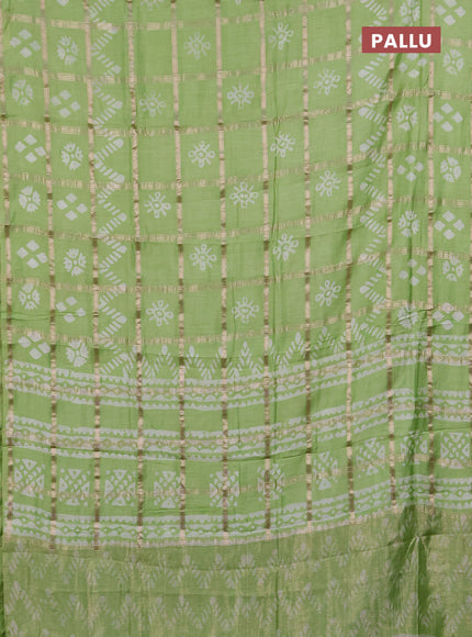 Semi chanderi saree pista green with allover zari checks & batik prints in borderless style