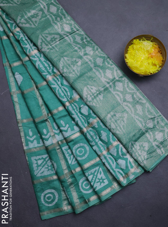 Semi chanderi saree green shade with allover zari checks & batik prints in borderless style