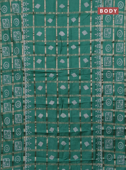 Semi chanderi saree green shade with allover zari checks & batik prints in borderless style