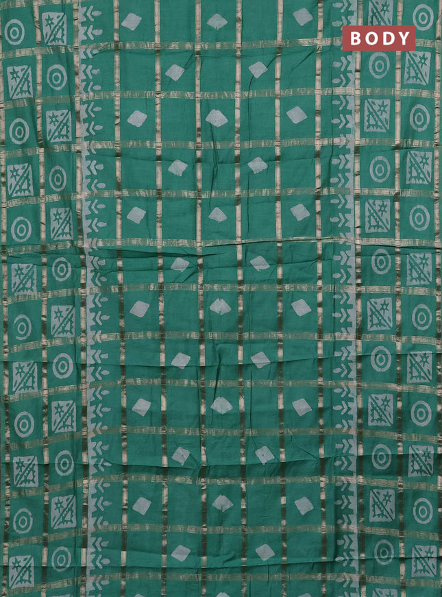 Semi chanderi saree green shade with allover zari checks & batik prints in borderless style