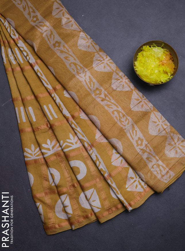 Semi chanderi saree mustard yellow with allover zari checks & batik prints in borderless style