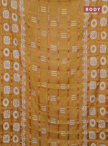 Semi chanderi saree mustard yellow with allover zari checks & batik prints in borderless style
