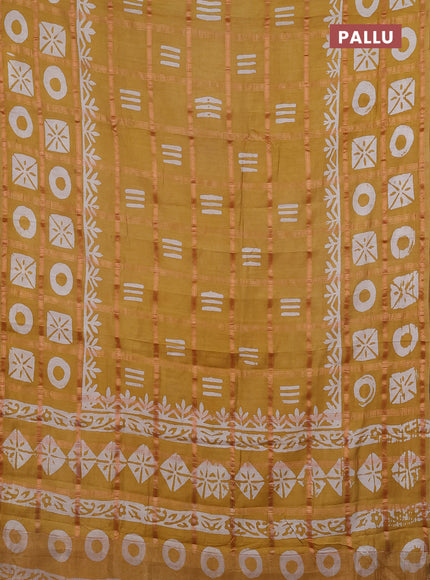 Semi chanderi saree mustard yellow with allover zari checks & batik prints in borderless style