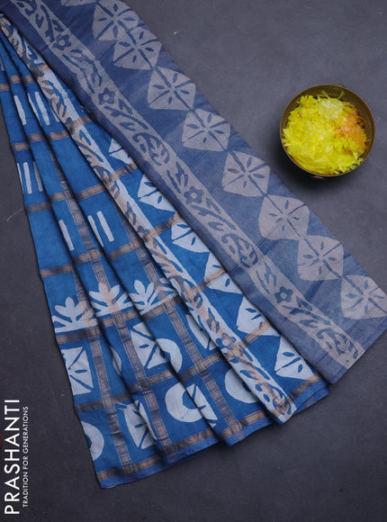 Semi chanderi saree blue shade with allover zari checks & batik prints in borderless style