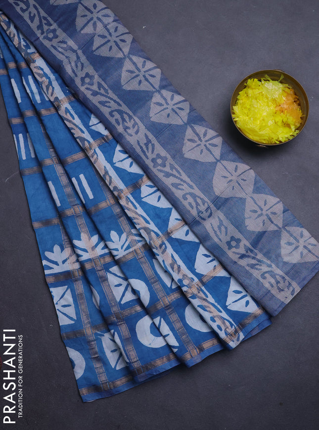 Semi chanderi saree blue shade with allover zari checks & batik prints in borderless style