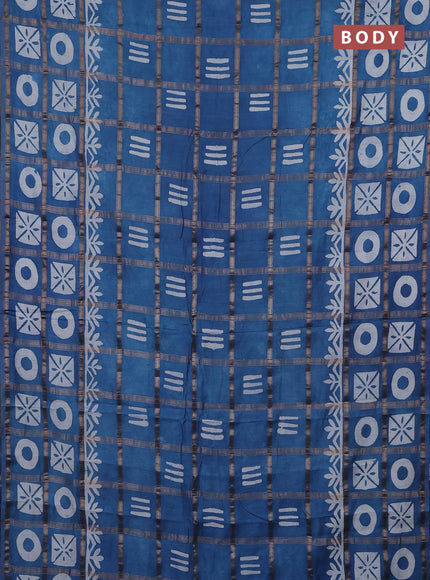 Semi chanderi saree blue shade with allover zari checks & batik prints in borderless style