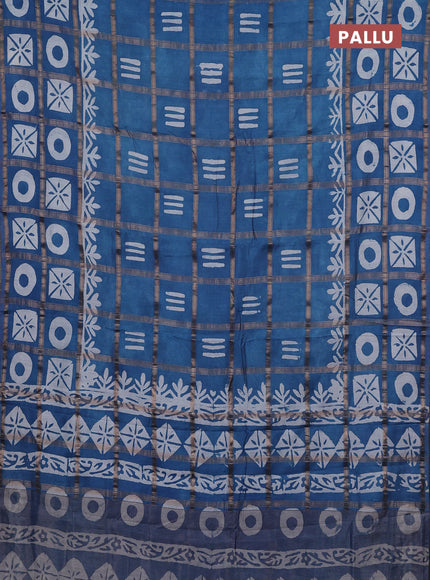 Semi chanderi saree blue shade with allover zari checks & batik prints in borderless style
