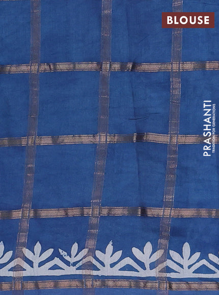 Semi chanderi saree blue shade with allover zari checks & batik prints in borderless style