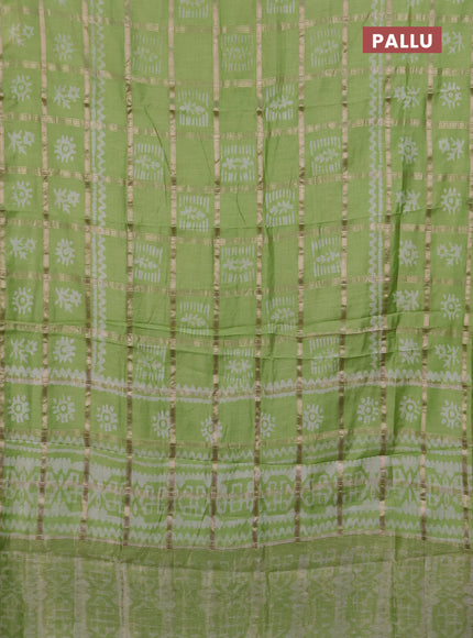 Semi chanderi saree parrot green with allover zari checks & batik prints in borderless style