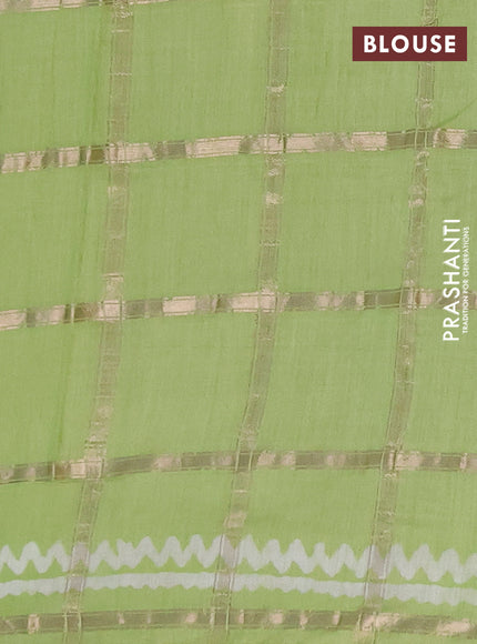 Semi chanderi saree parrot green with allover zari checks & batik prints in borderless style