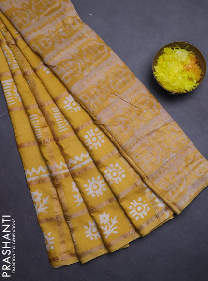 Semi chanderi saree mustard yellow with allover zari checks & batik prints in borderless style