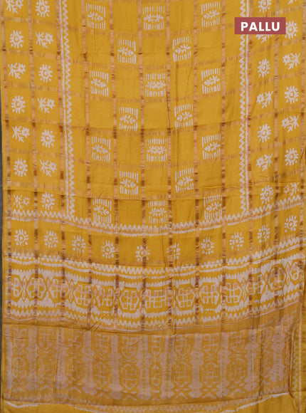 Semi chanderi saree mustard yellow with allover zari checks & batik prints in borderless style