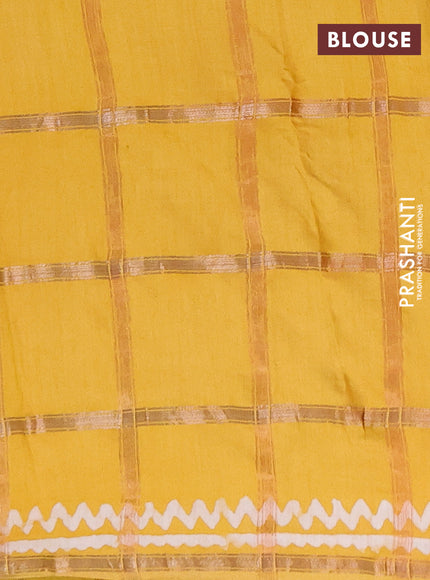 Semi chanderi saree mustard yellow with allover zari checks & batik prints in borderless style