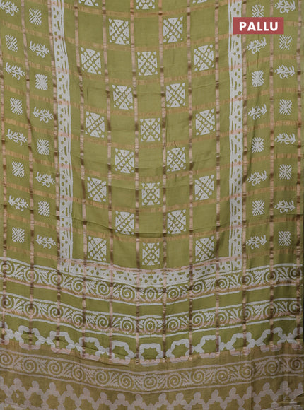 Semi chanderi saree mehendi green and off white with allover zari checks & batik prints and batik printed border