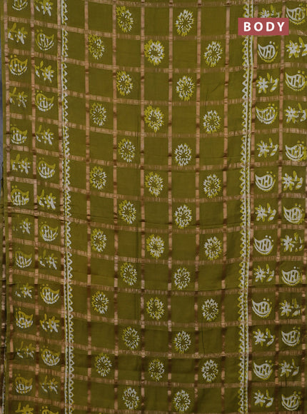 Semi chanderi saree mehendi green and off white with allover zari checks & batik prints and batik printed border