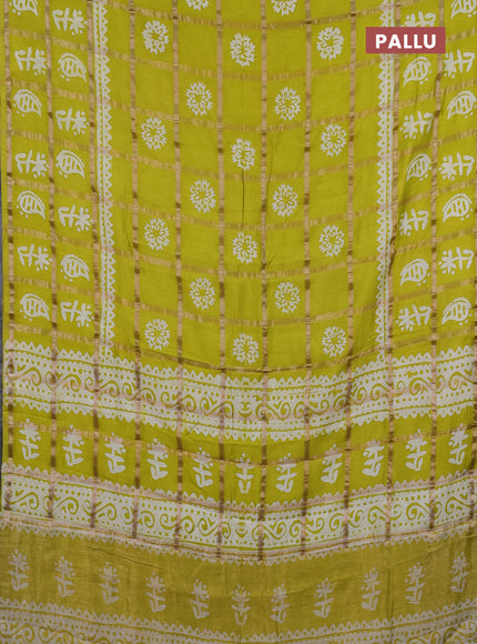 Semi chanderi saree lime yellow and off white with allover zari checks & batik prints and batik printed border