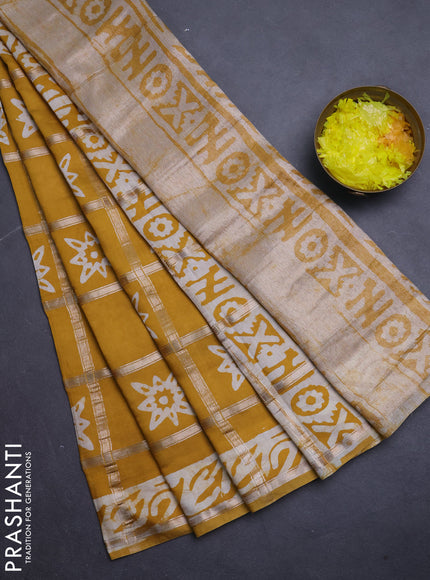 Semi chanderi saree mustard and off white with allover zari checks & batik prints and batik printed border