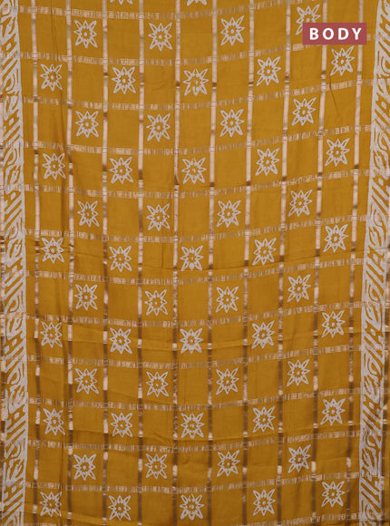 Semi chanderi saree mustard and off white with allover zari checks & batik prints and batik printed border
