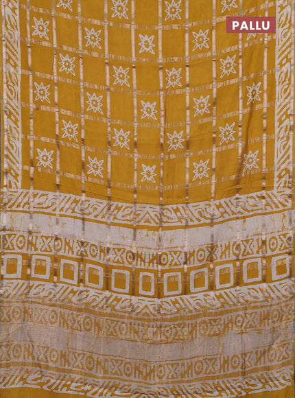 Semi chanderi saree mustard and off white with allover zari checks & batik prints and batik printed border