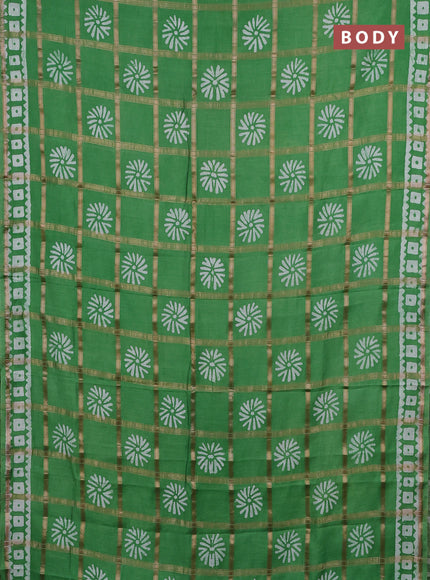 Semi chanderi saree green and off white with allover zari checks & batik prints and batik printed border