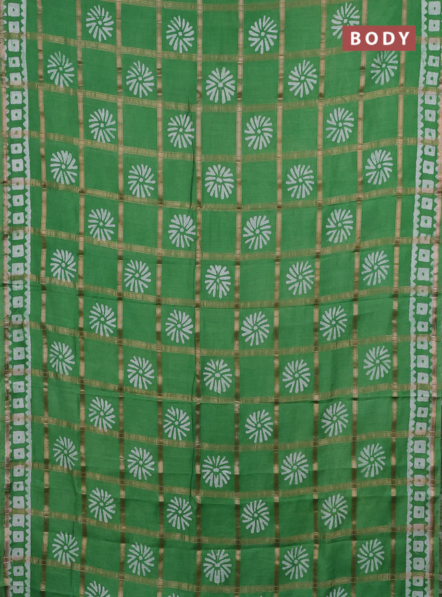 Semi chanderi saree green and off white with allover zari checks & batik prints and batik printed border