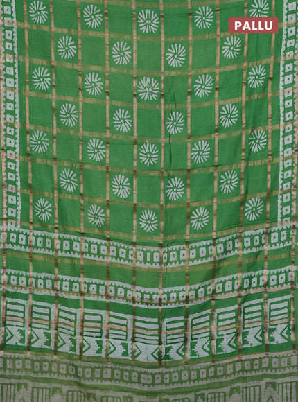 Semi chanderi saree green and off white with allover zari checks & batik prints and batik printed border