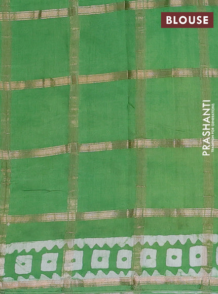 Semi chanderi saree green and off white with allover zari checks & batik prints and batik printed border
