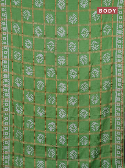Semi chanderi saree green with allover zari checks & batik prints in borderless style