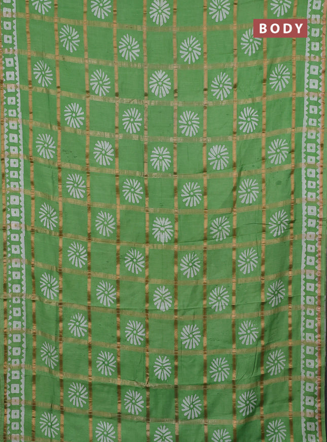 Semi chanderi saree green with allover zari checks & batik prints in borderless style