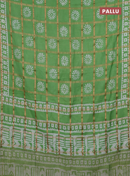 Semi chanderi saree green with allover zari checks & batik prints in borderless style
