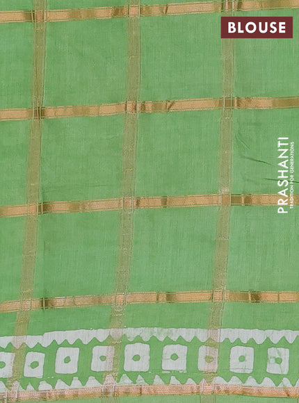 Semi chanderi saree green with allover zari checks & batik prints in borderless style