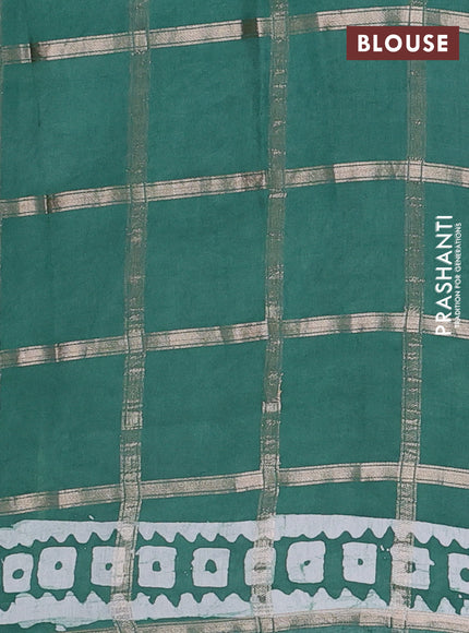 Semi chanderi saree teal green with allover zari checks & batik prints in borderless style